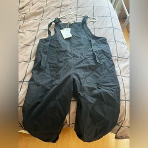 Lucy & Yak black jumpsuit. Brand new and never worn. Fits a size large.
